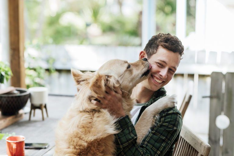 Happy man enjoying his dog's company